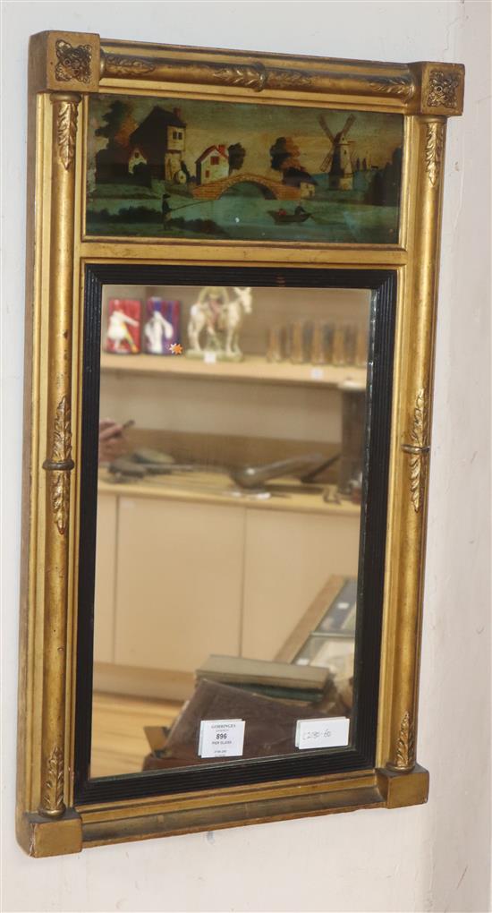 A small Regency gilt frame pier glass, with reverse painted frieze of a windmill in landscape